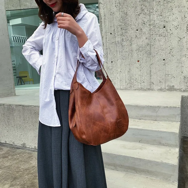 Solid Color Dumpling Shape Shoulder Bag for Women in PU Leather with Sewing Thread Detail, Perfect for Spring